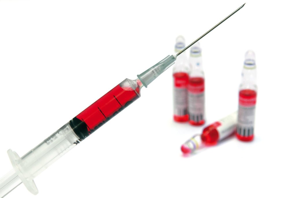 Syringe and vitamin ampoules