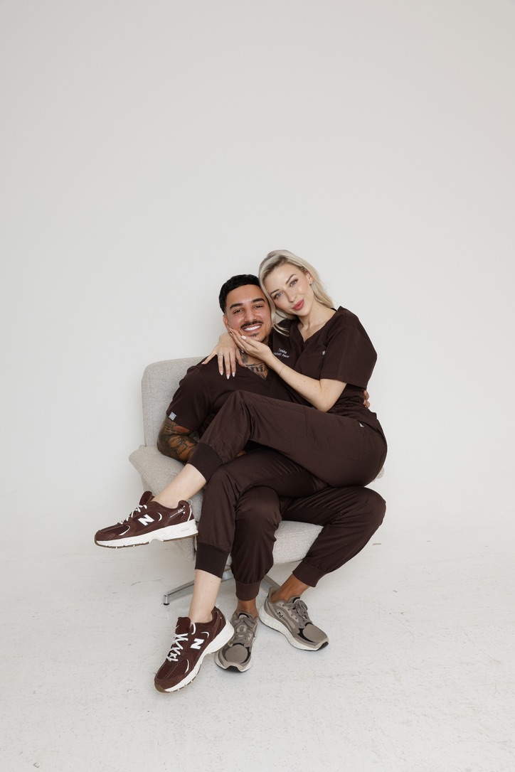 Two Academy educators in clinic uniform