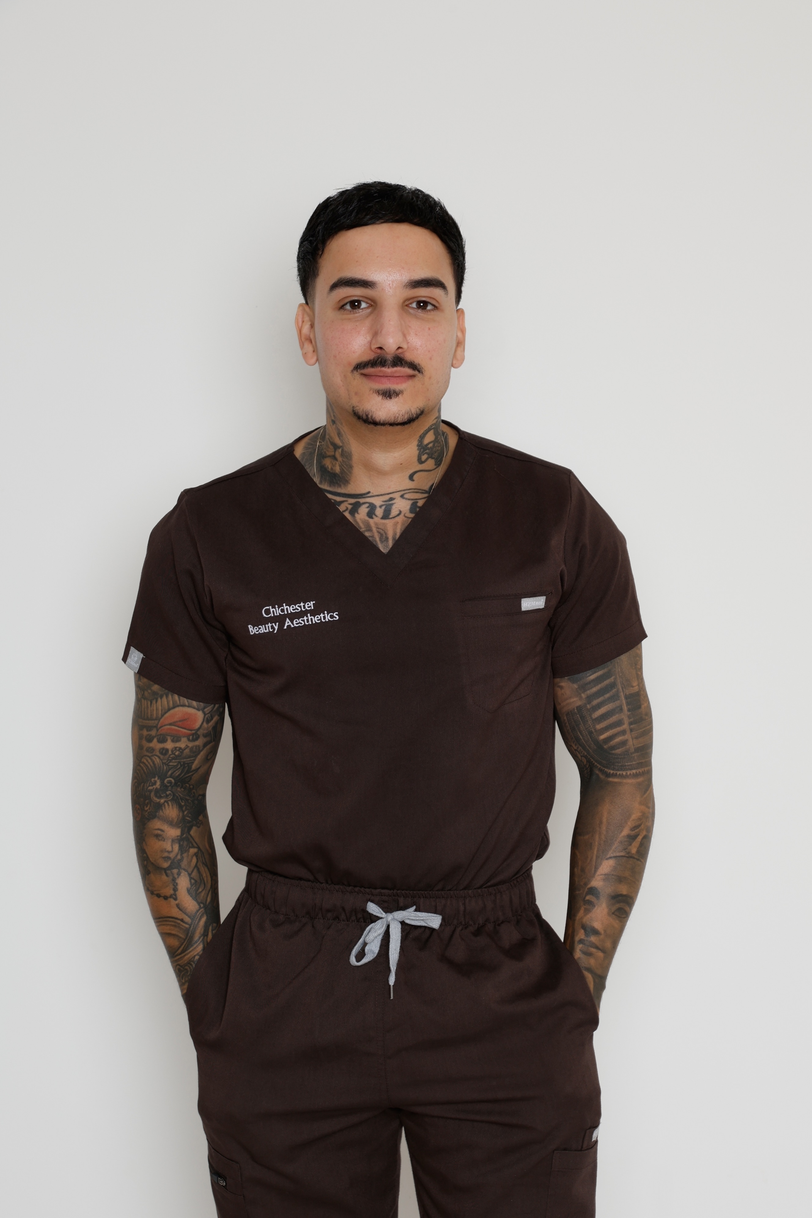 Michael, Director, Aesthetics Practitioner, Laser Specialist and Educator, in clinic uniform